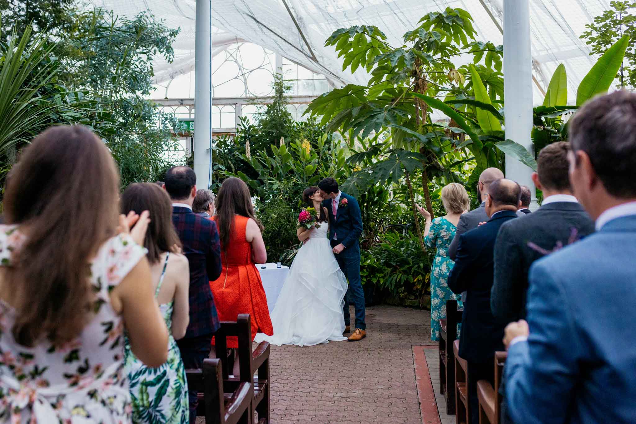 wedding-winter-gardens-ceremony-bride-groom-first-kiss