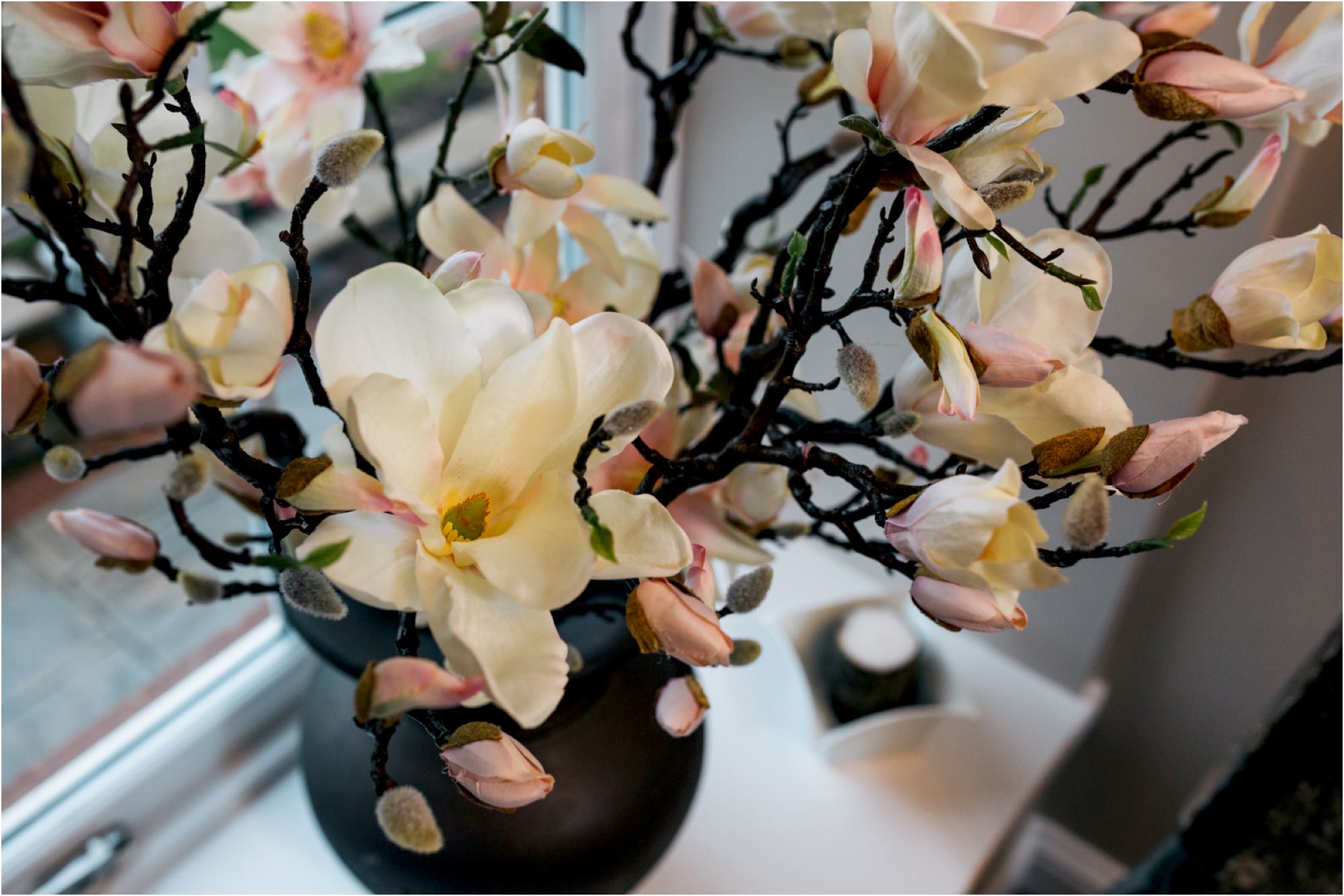 silk-flower-arrangement-indoor-window-sill