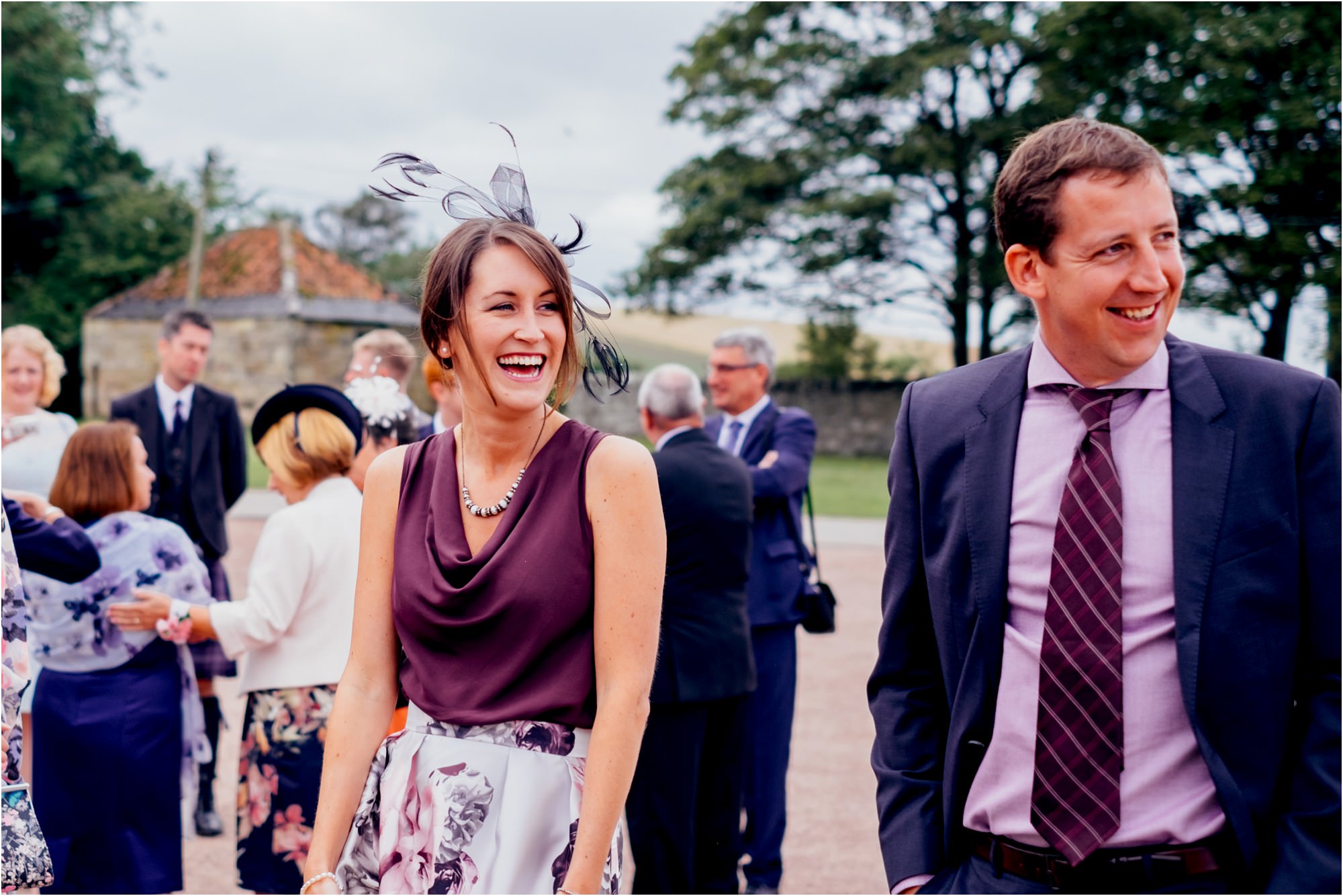 wedding-guests-talking-outside-kinkell-byre