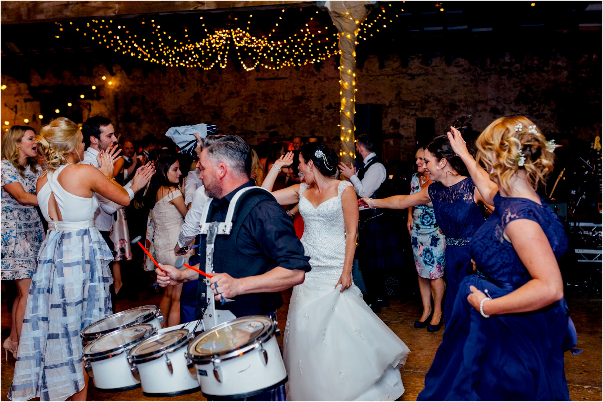 bride-groom-follow-pipe-band-conga-line