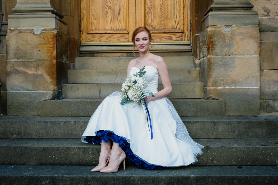bride-sitting-steps-vintage-dress-blue-underskirt