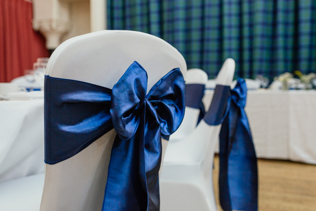 white-chair-covers-blue-bows