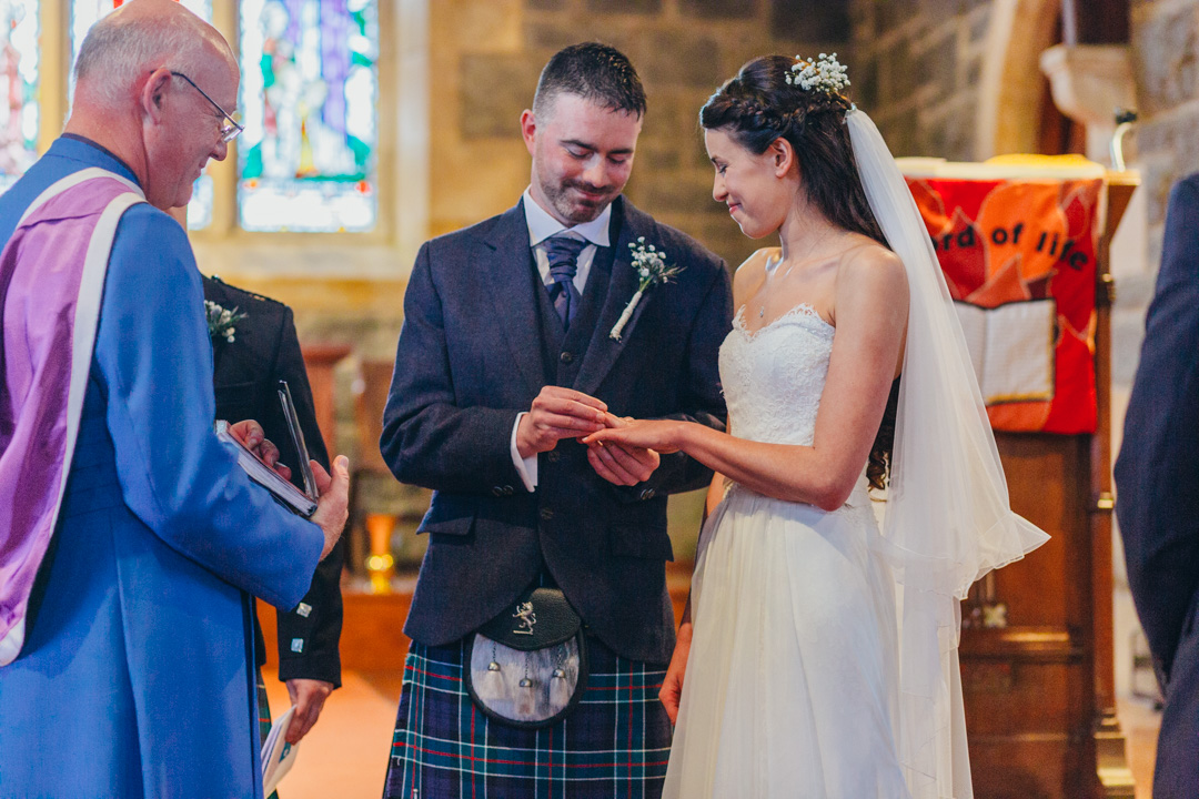 groom-giving-bride-wedding-ring