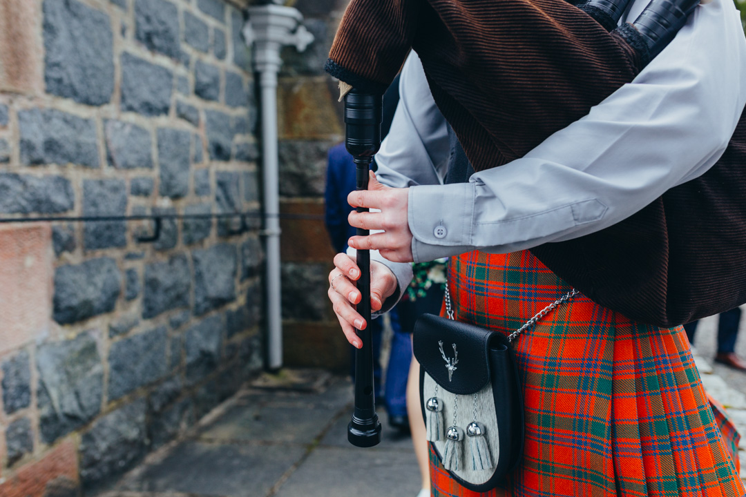 young-female-piper-playing-bagpipes
