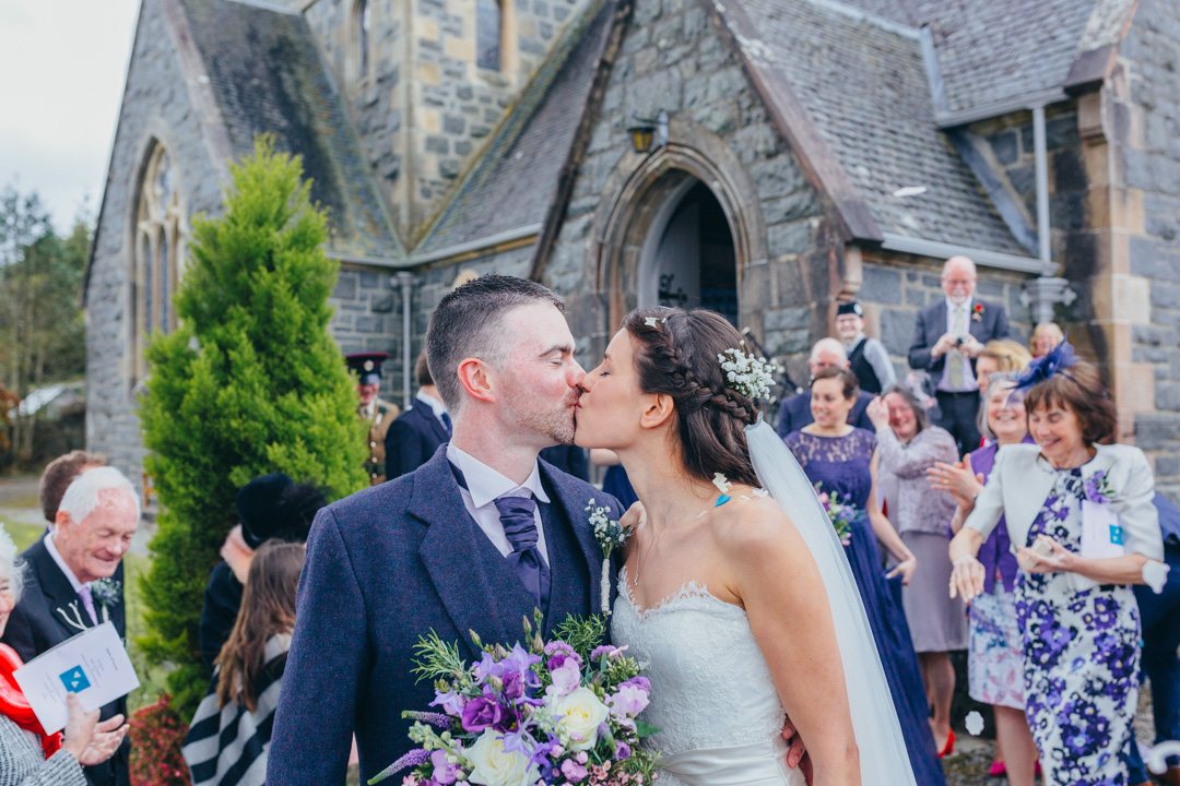 bride-groom-kiss-outside-st-orans-church