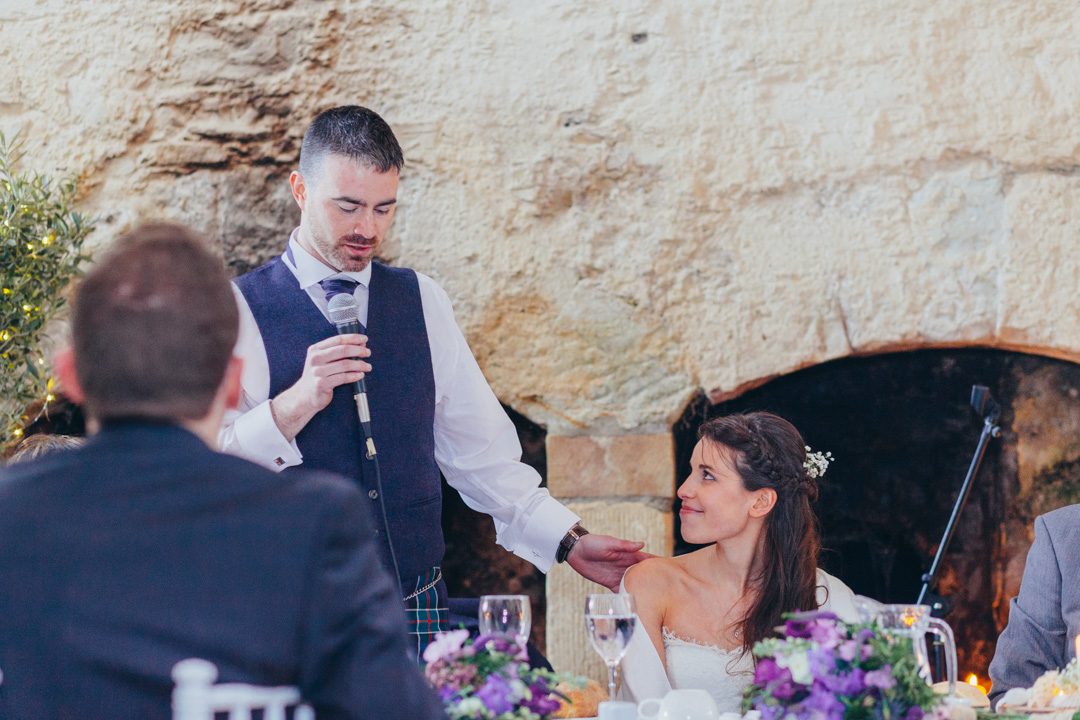 groom-speaking-to-wife-during-speech