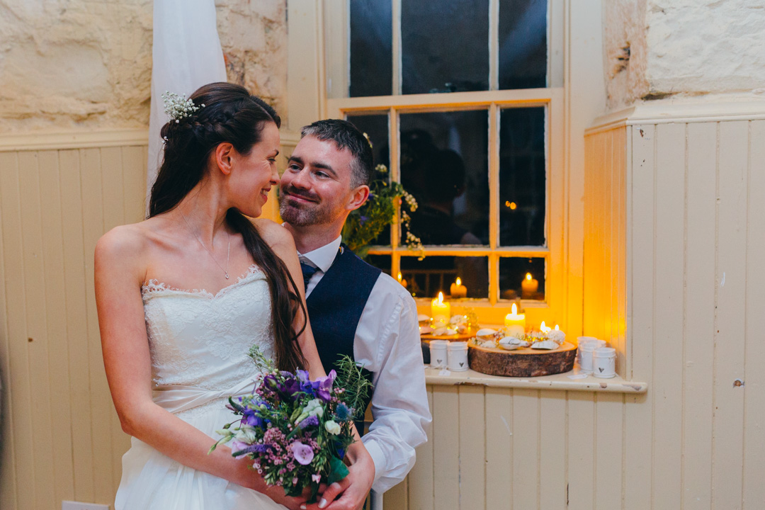 bride-sitting-grooms-knee-lochnell-castle-wedding