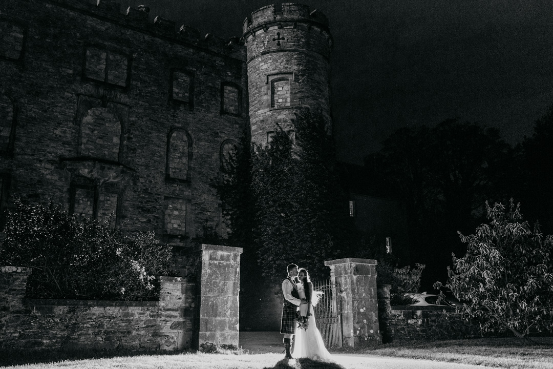 couple-embracing-outside-lochnell-castle