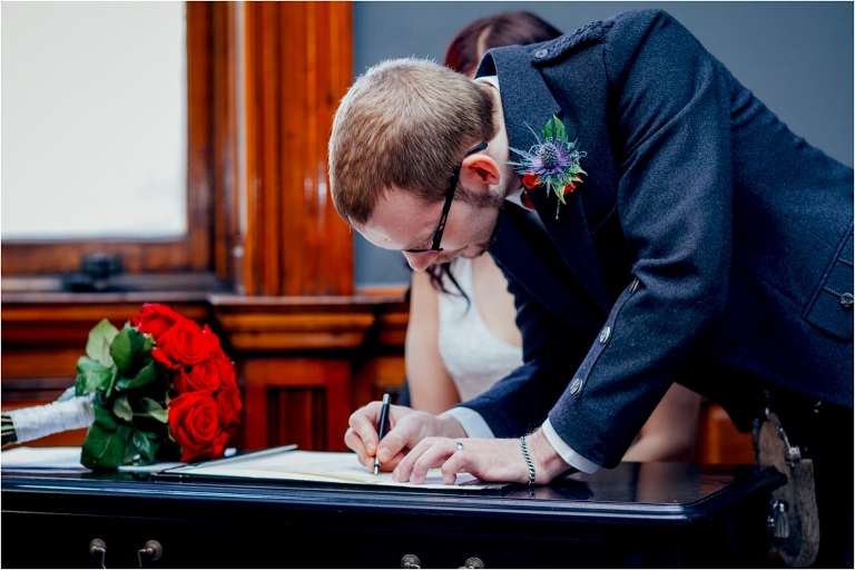 groom-signing-register