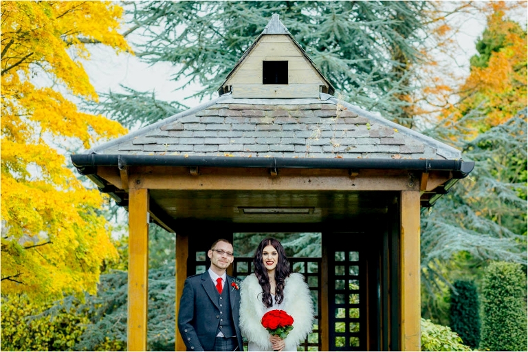 couple-standing-under-japanese-gazebo