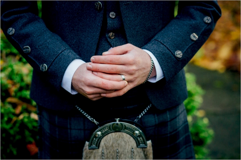 groom-touching-his-wedding-ring