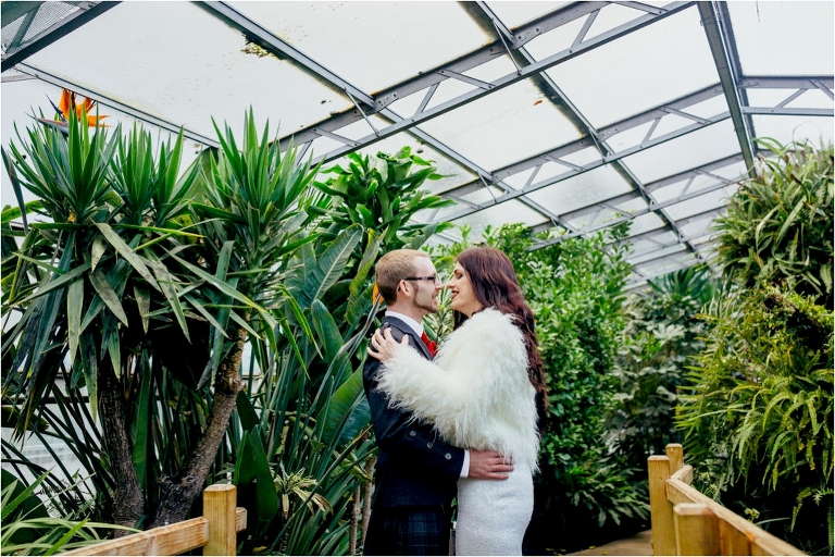couple-embracing-greenhouse-viewpark-gardens