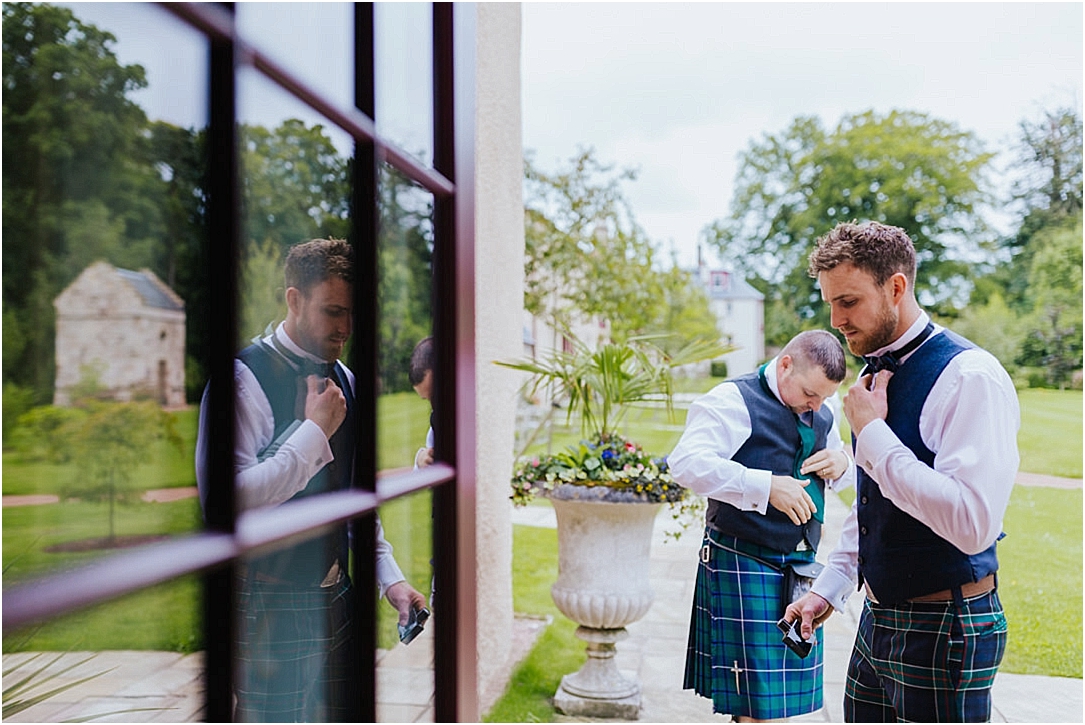 reflection-of-groom-glass-door