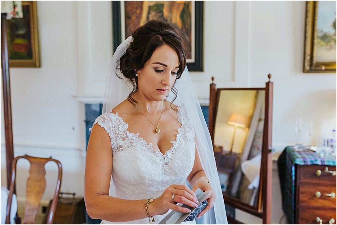 bride-opening-present-from-groom