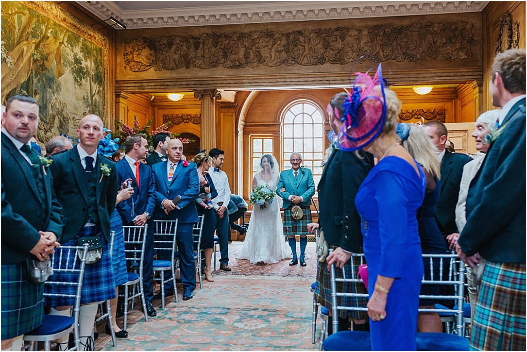 bride-walking-down-aisle-tapestry-room