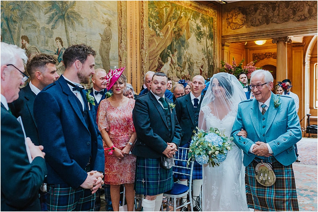 bride-seeing-groom-tapestry-room