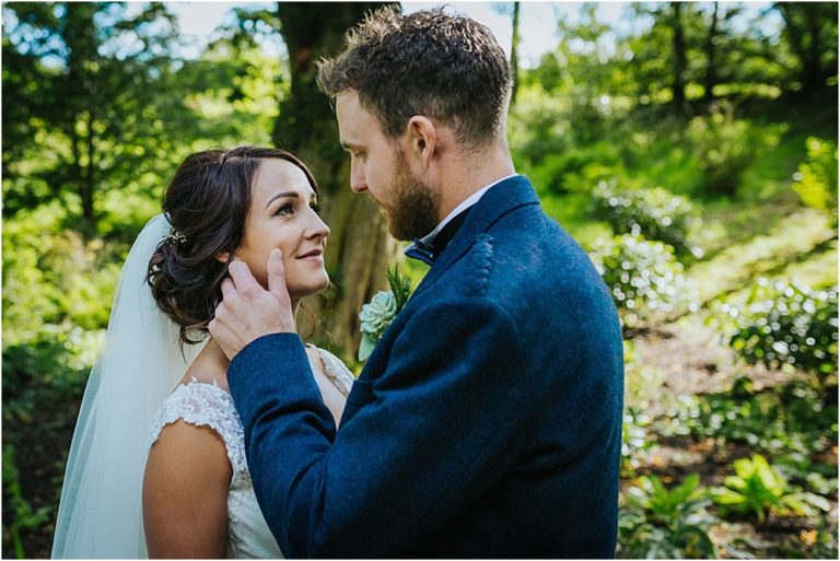 groom-caressing-brides-cheek