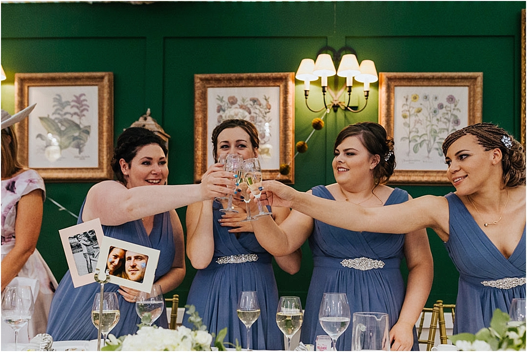 bridesmaids-cheersing-glasses