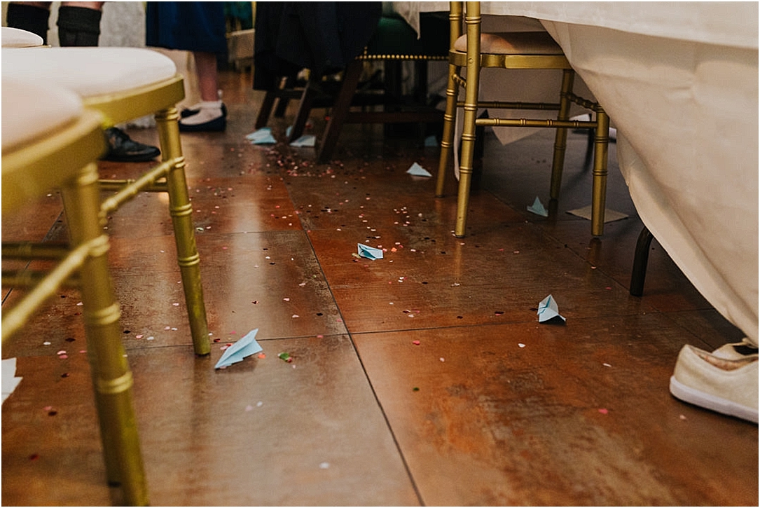 paper-aeroplanes-confetti-on-floor
