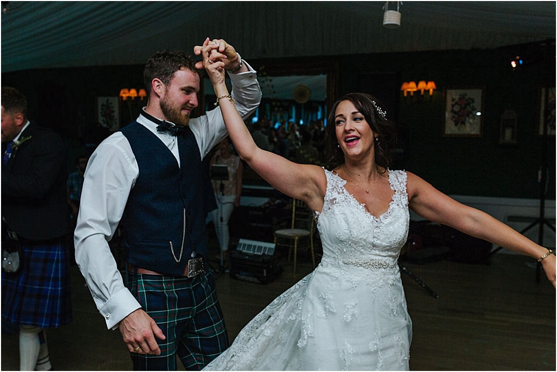 bride-spinning-under-grooms-arm