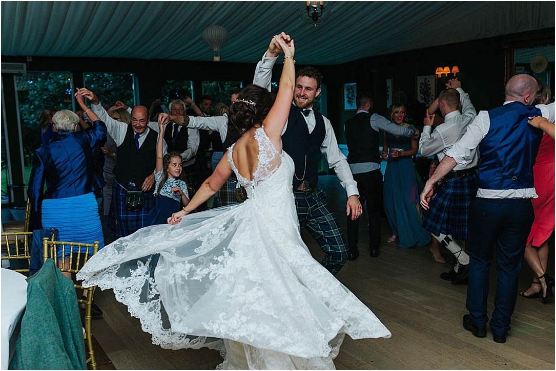ceilidh-dancing-bride-spinning-dress
