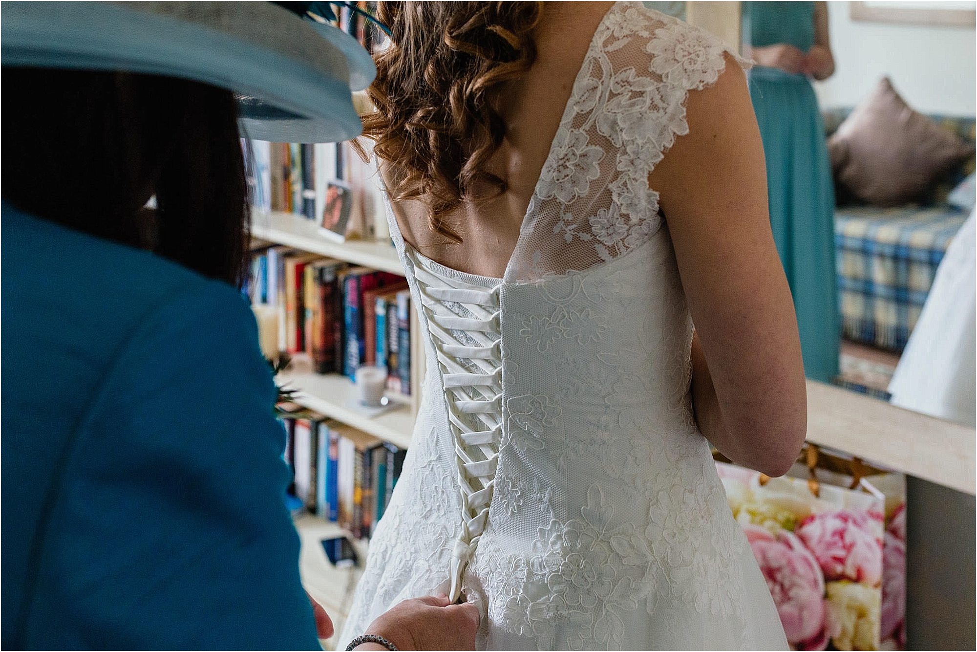 mum-fastening-back-brides-dress