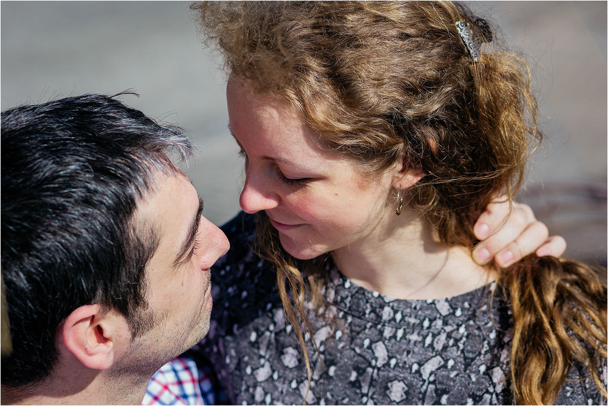 couple-cuddling-smiling