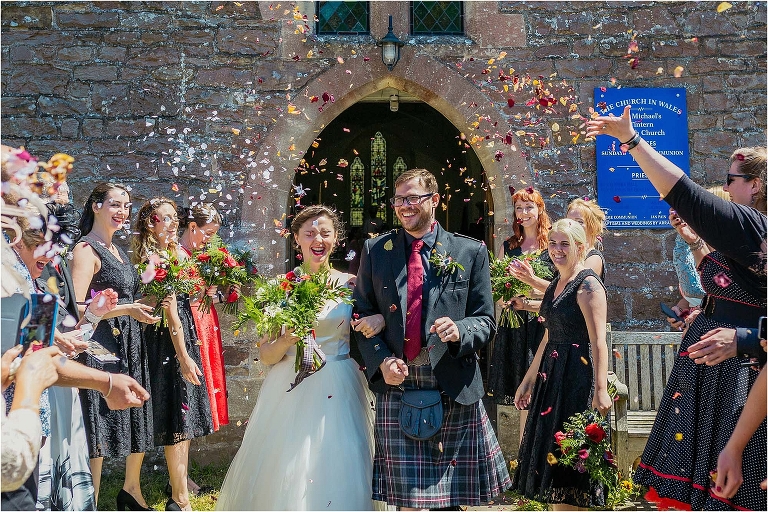 bride-groom-walking-through-confetti