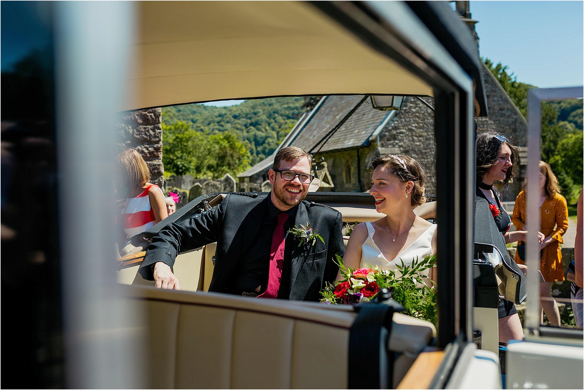 bride-groom-sitting-in-back-wedding-car