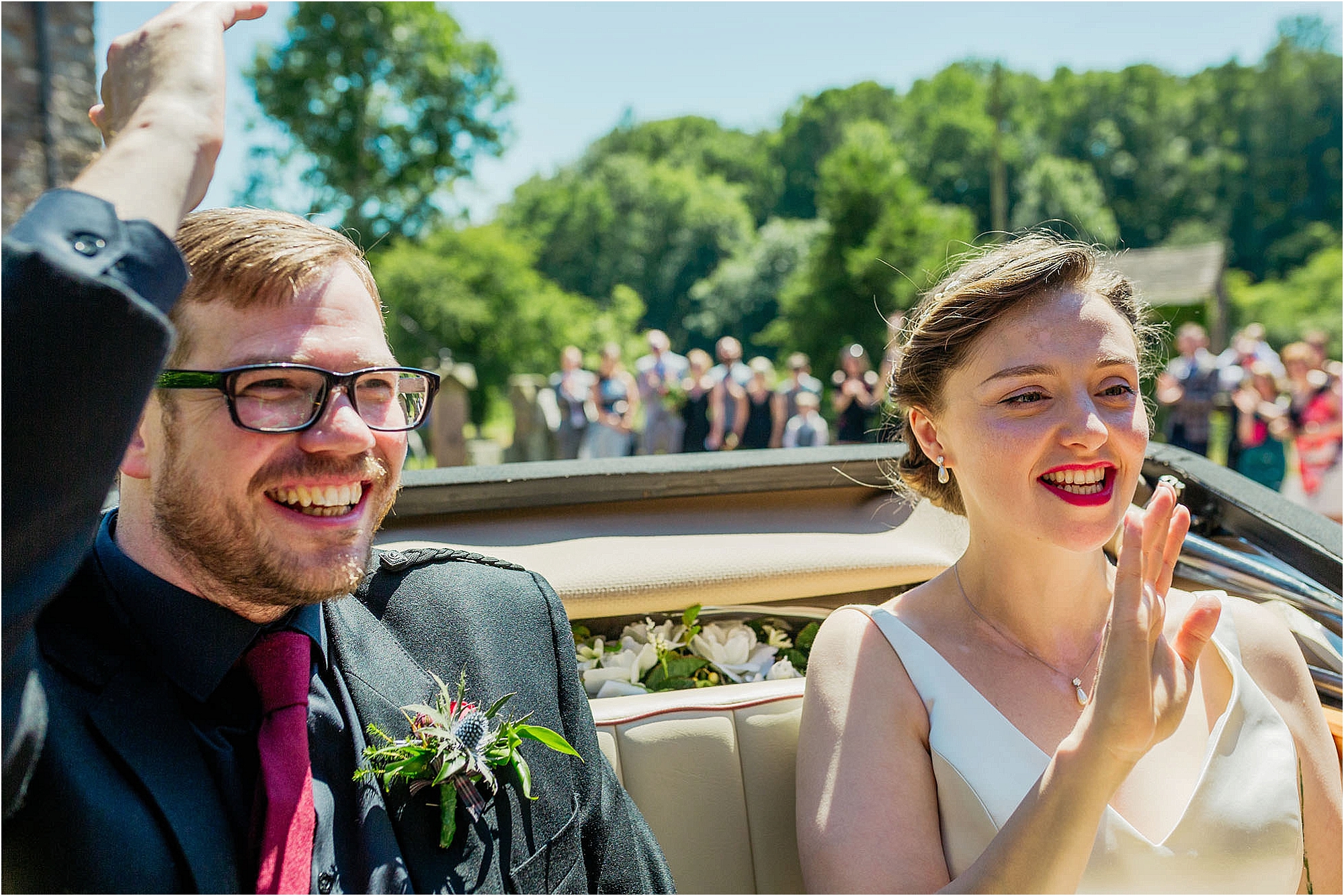 bride-groom-sitting-in-back-wedding-car