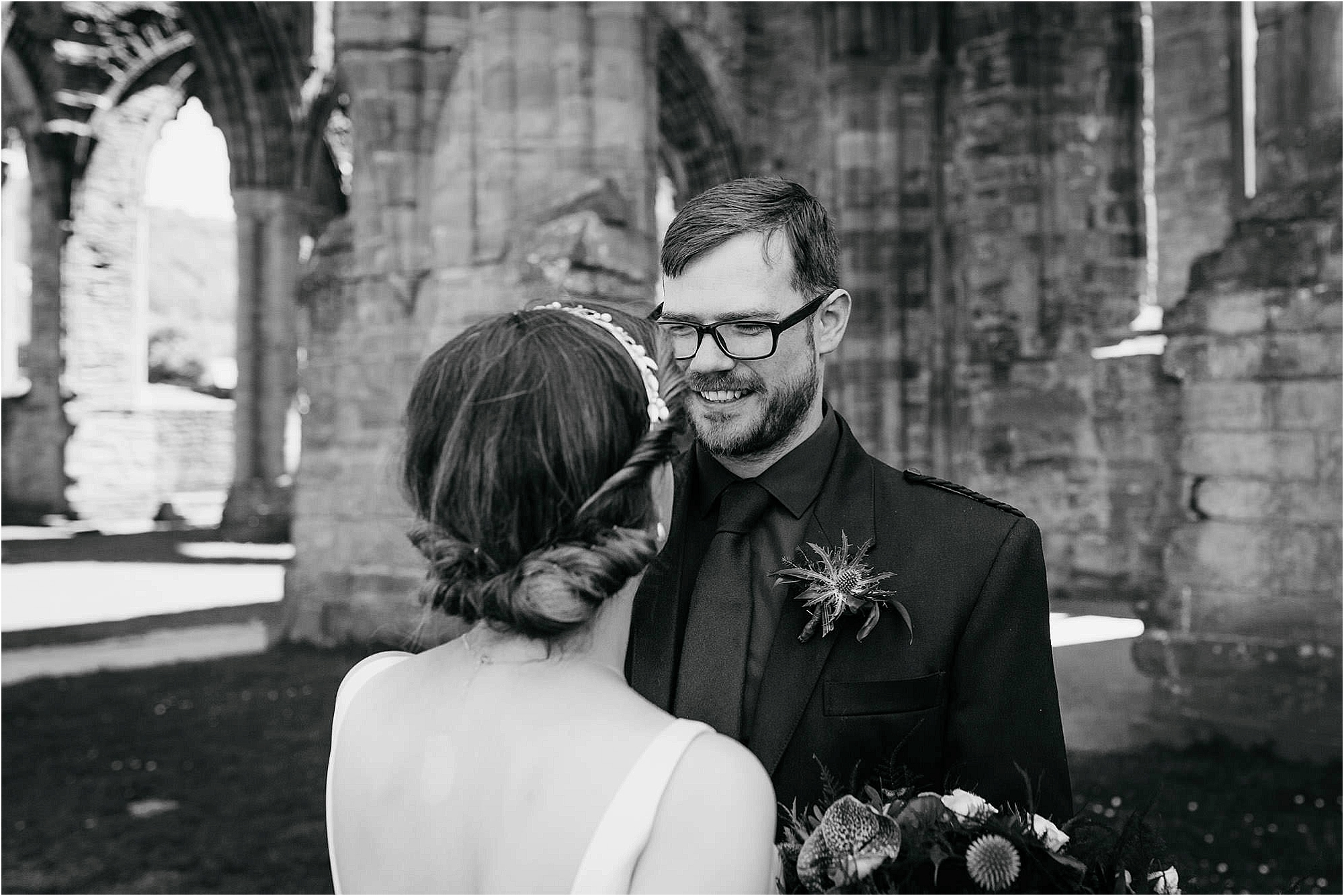 groom-smiling-at-bride