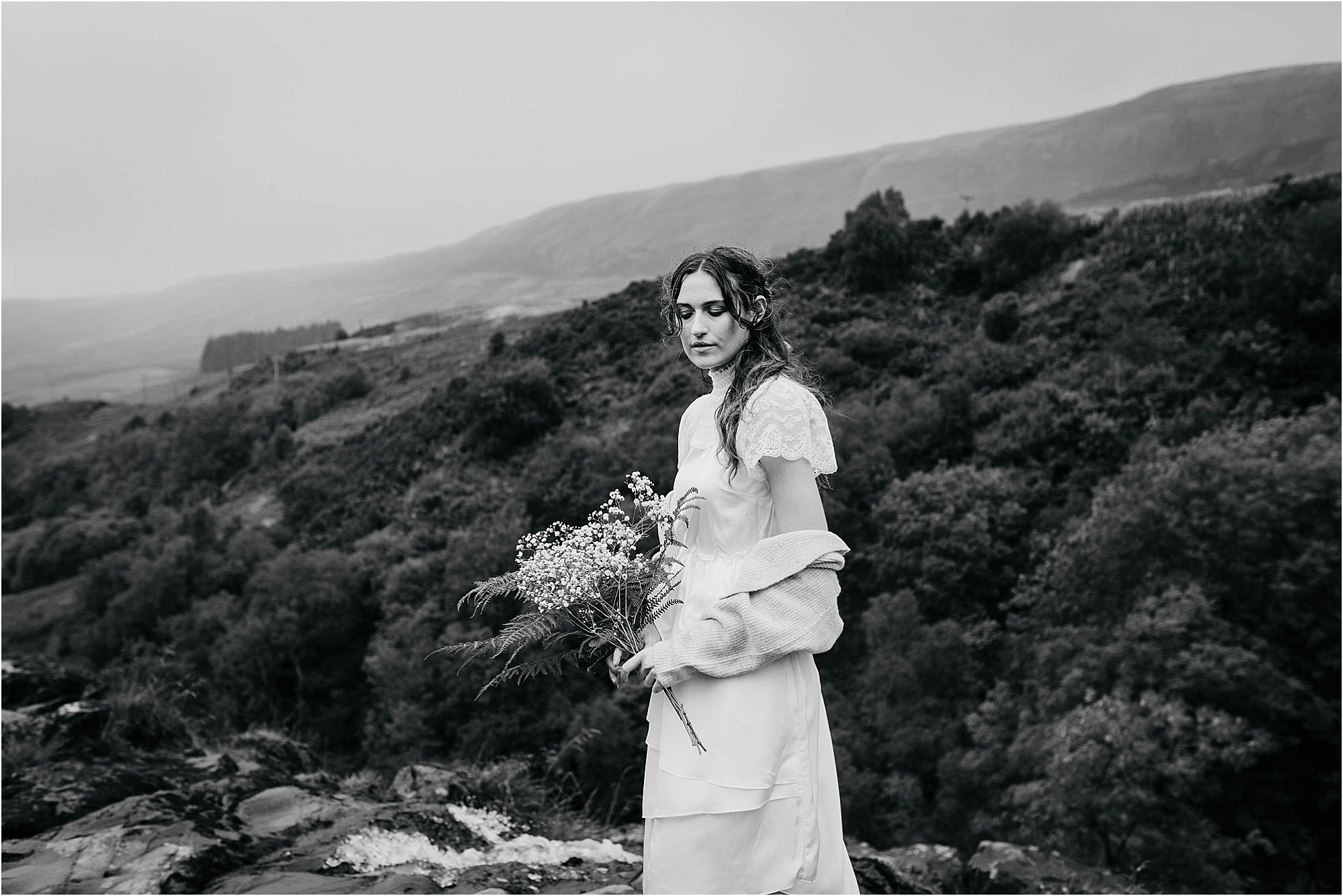 black-and-white-photo-bride-looking-out-to-countryside