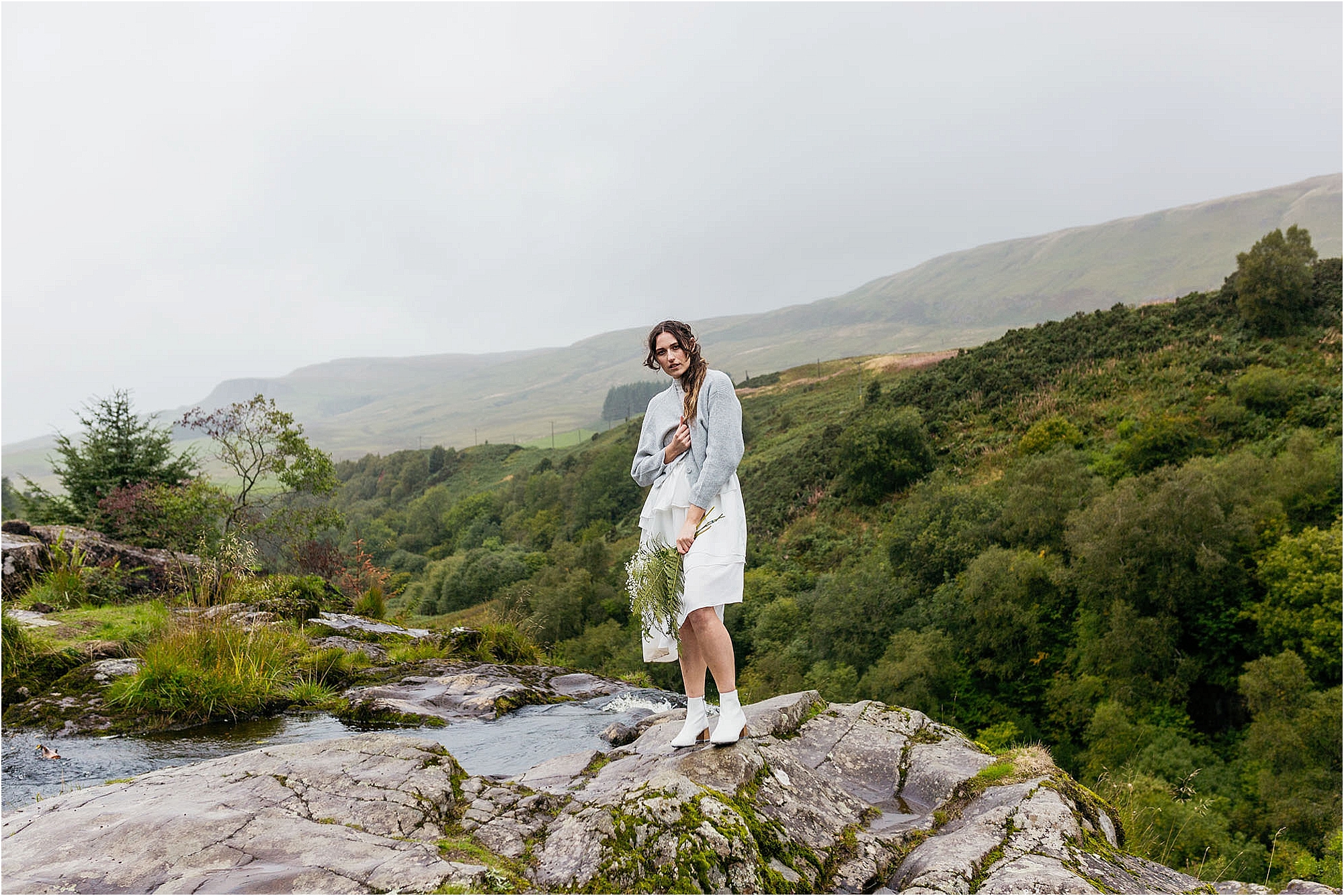bride-standing-at-top-of-fintry-waterfall