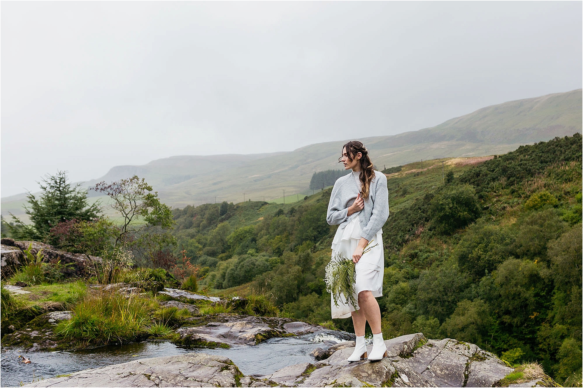 bride-standing-at-top-of-fintry-waterfall