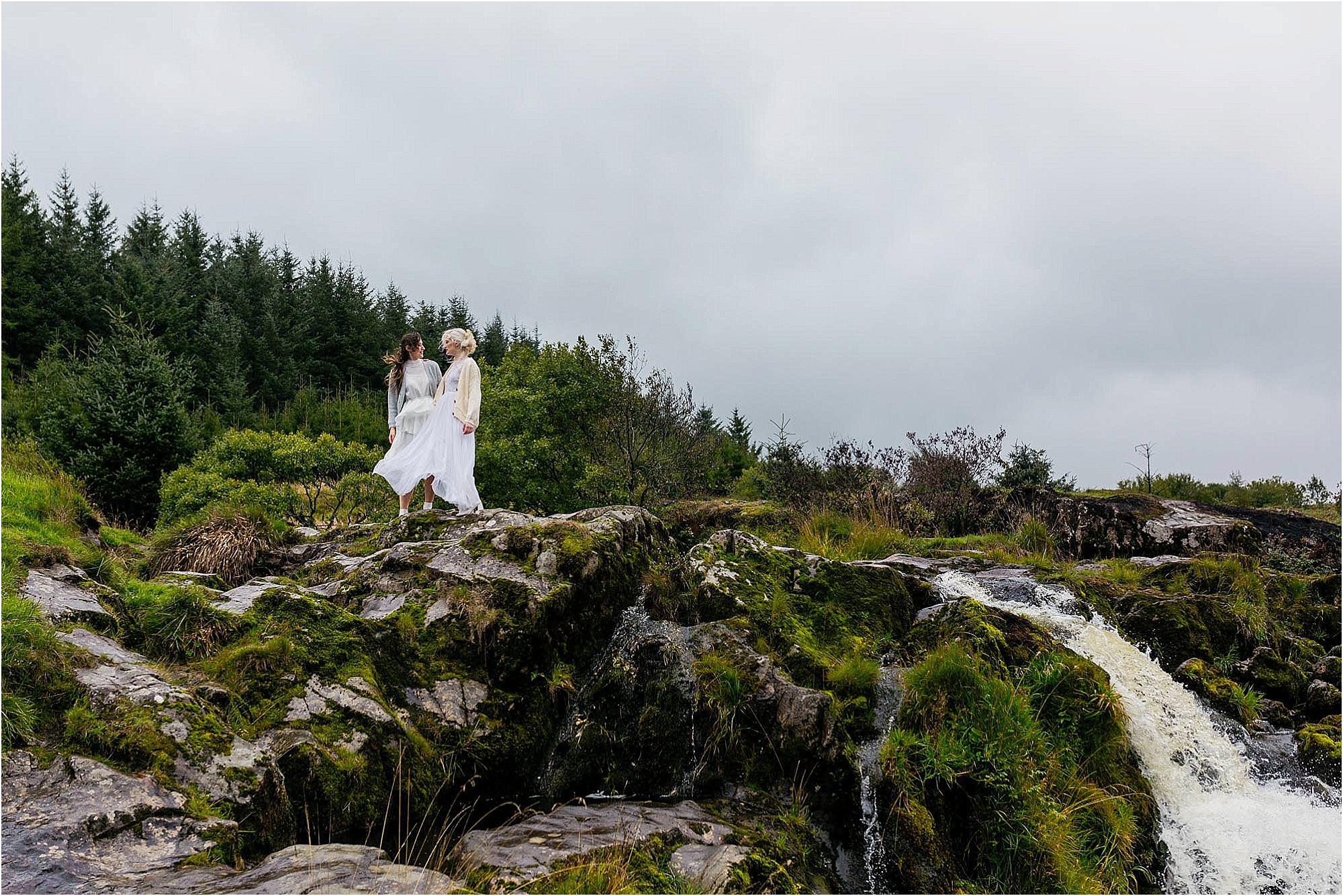 gay-couple-standing-on-top-of-waterfall