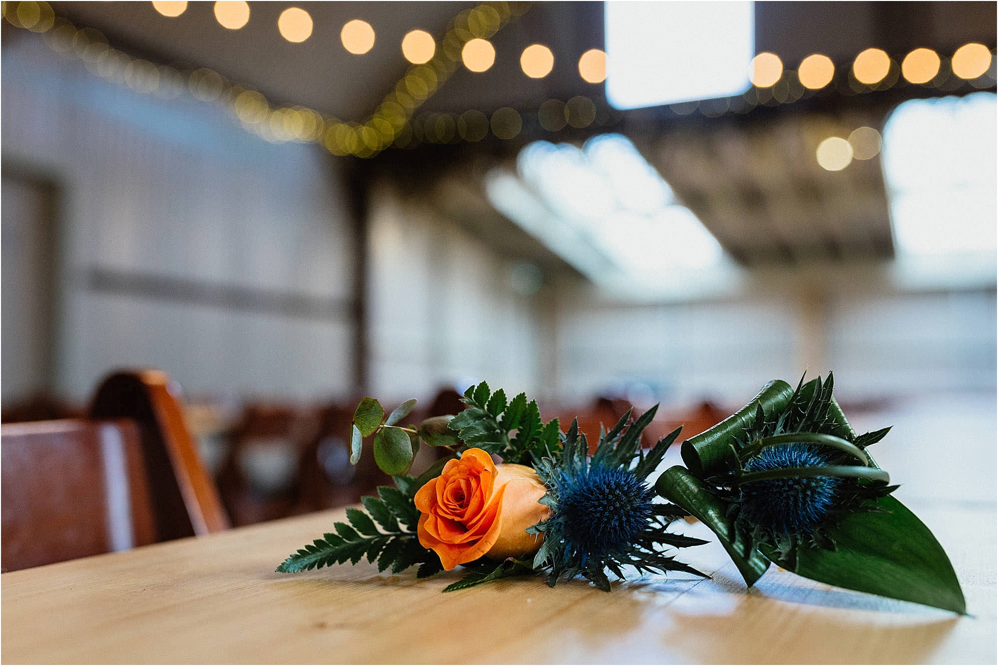rose-thistle-buttonholes-with-green-leaves