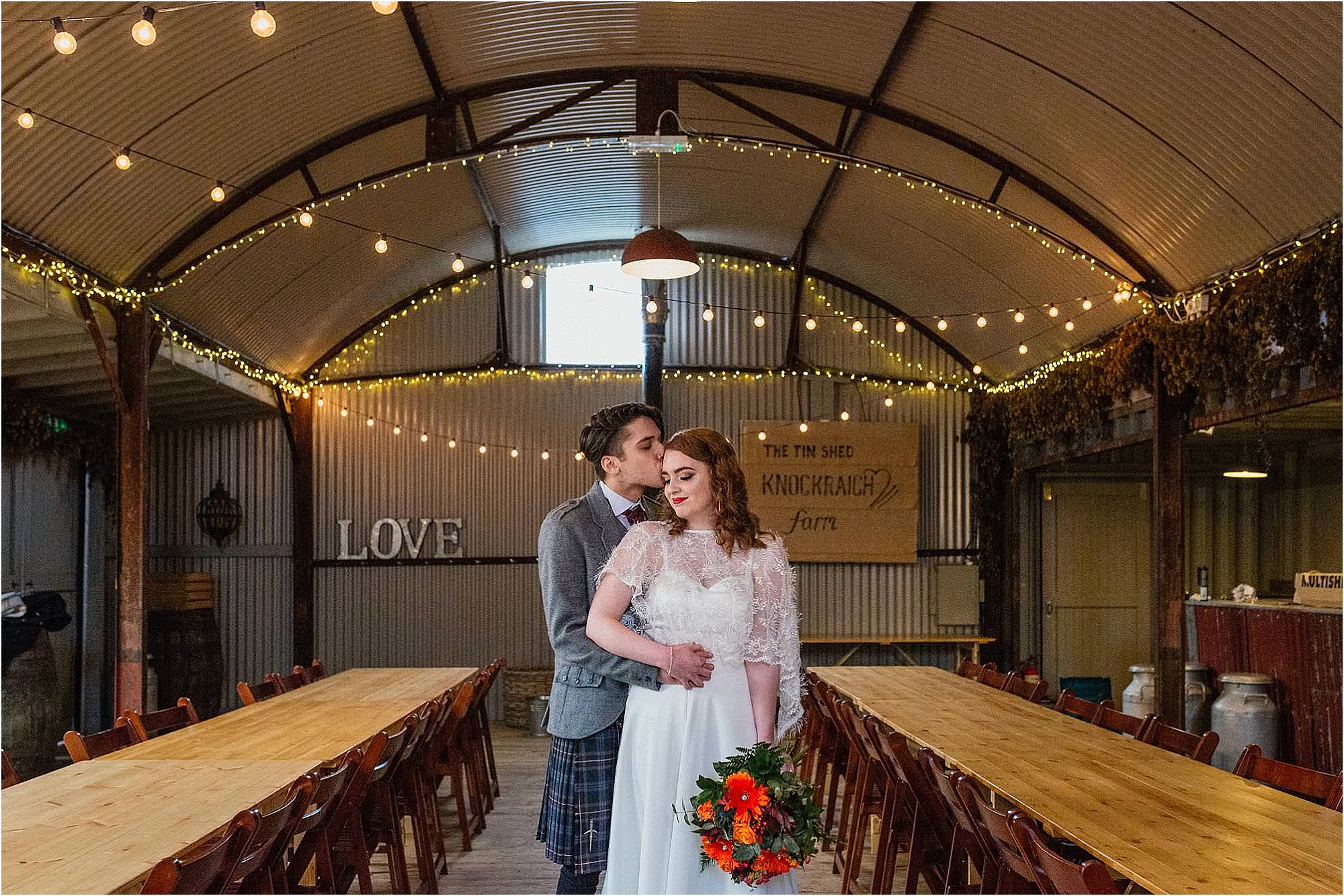 groom-kissing-brides-forehead