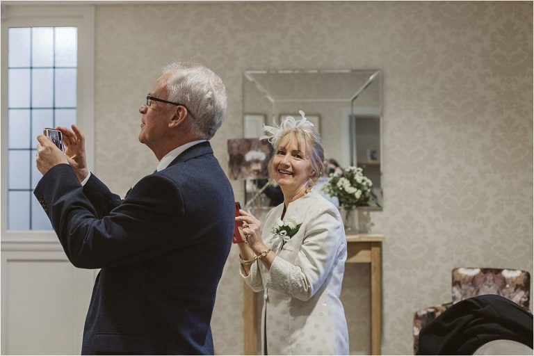 wedding-guest-smiling-at-camera