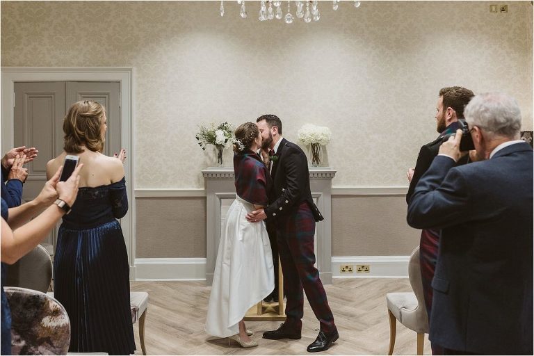 bride-and-groom-share-first-kiss