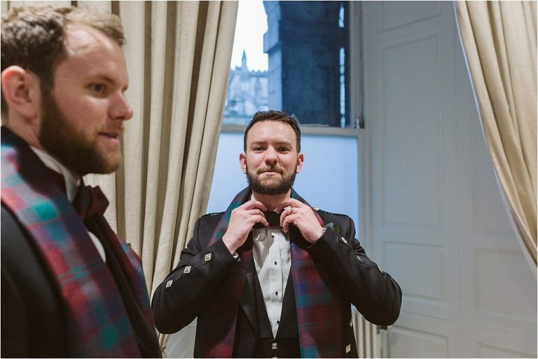 groom-adjusting-his-tartan-bow-tie