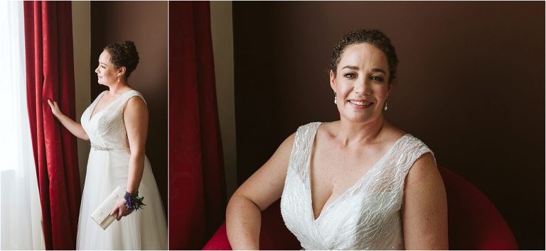 bride-looks-out-of window-then-in-to-camera-smiling