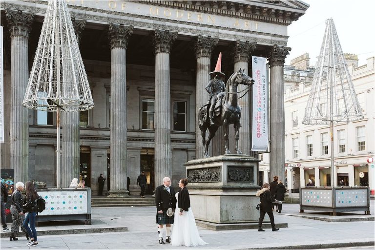 couple-pose-outside-GoMA-next-to-Duke-of-wellington-statue