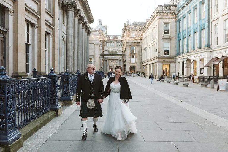 bride-and-groom-walking-through-merchant-square-glasgow