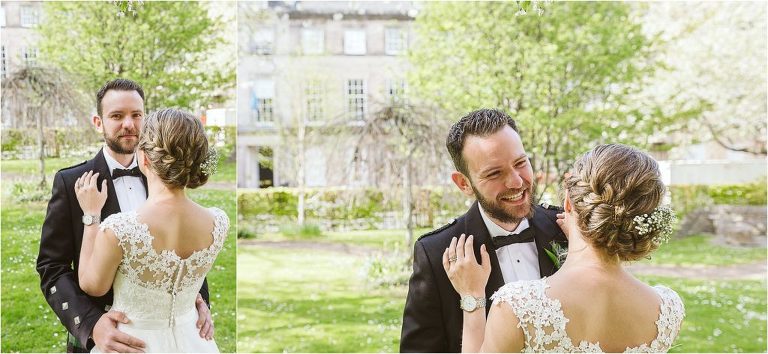 groom-laughs-with-his-wife-and-looks-towards-camera