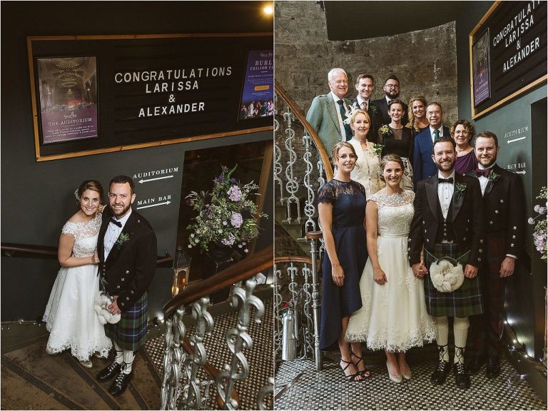 bride-and-groom-pose-with-family-on-stairs-of-ghillie-dhu