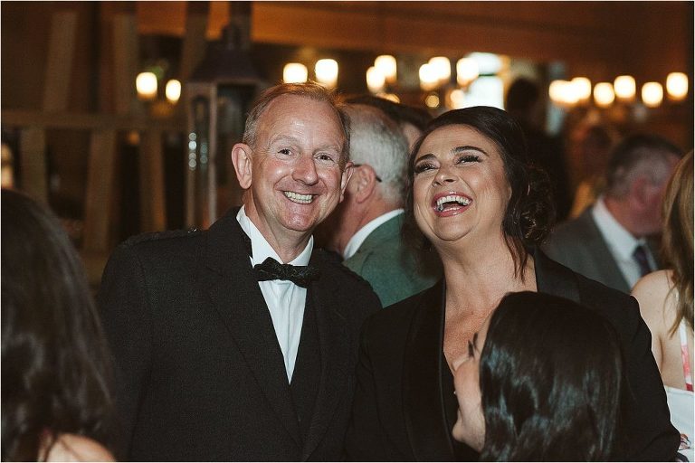 guests-smiling-and-laughing-at-camera