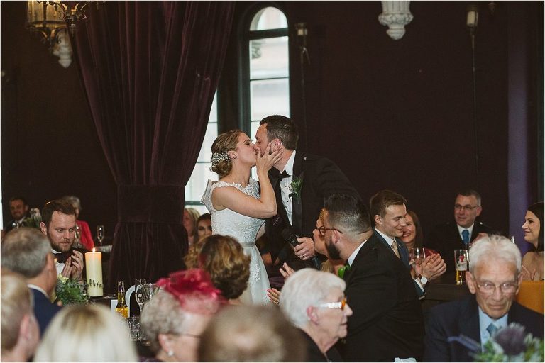 bride-kisses-groom-after-he-finishes-his-speech