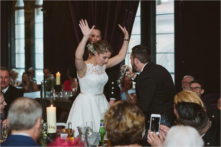 bride-celebrating-with-hands-in-the-air