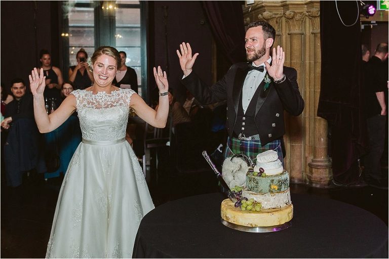 bride-groom-give-up-trying-to-cut-through-cheese-and-leave-knife-stuck-in