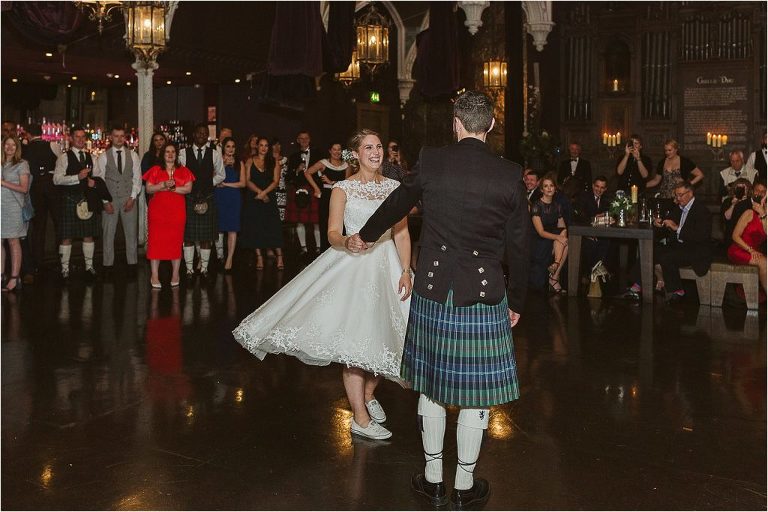 brides-dress-flares-out-as-she-is-spun-during-first-dance